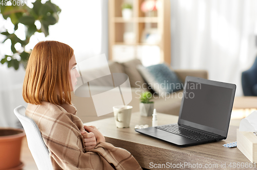 Image of sick woman having video call on laptop at home
