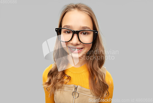 Image of smiling teenage student girl in glasses