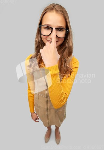 Image of smiling teenage student girl in glasses