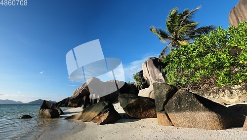 Image of Scenic granite rocks and palm trees at Anse Source d&#39;Argent beach on the La Digue island, Seychelles