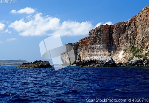 Image of Scenic view of the sea and cliffs of Gozo island in Malta in bright day