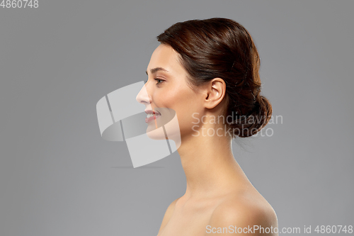Image of profile of beautiful woman with bare shoulders