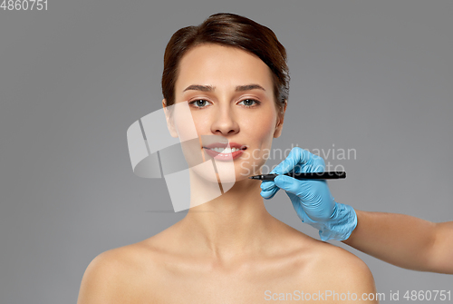 Image of beautiful young woman and hand with marker