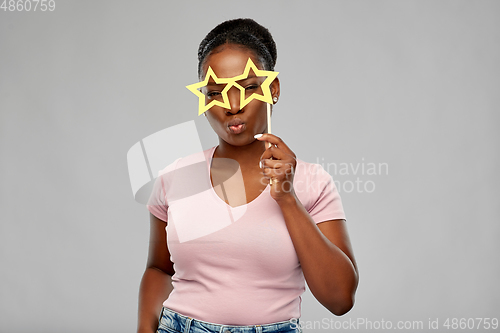 Image of african american woman with star shaped glasses