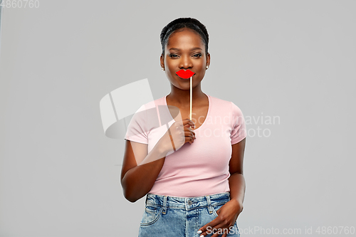 Image of african american woman with red lips accessory