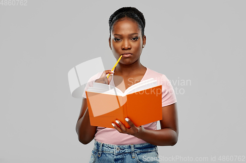 Image of african american woman with notebook