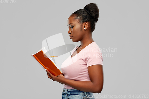 Image of african american woman with notebook