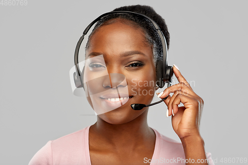 Image of african american woman in headset with microphone