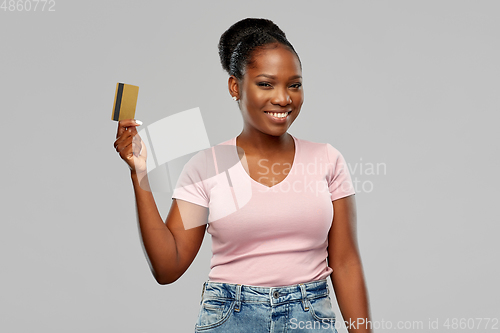 Image of happy african american woman with credit card