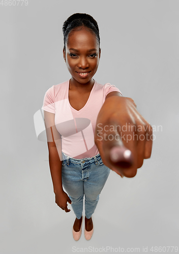 Image of african american woman pointing finger at camera