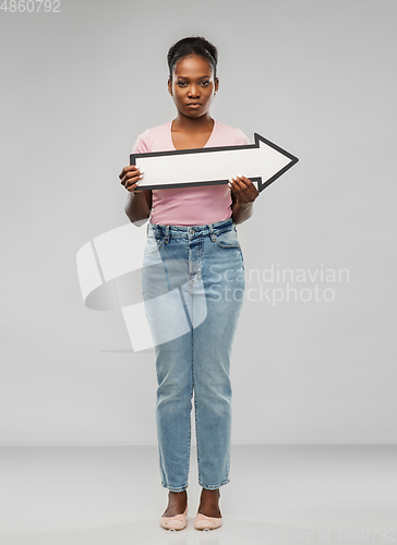 Image of sad african american woman with rightwards arrow