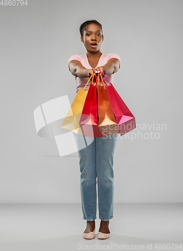 Image of african american woman with shopping bags