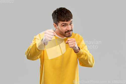 Image of man fighting with fists or boxing