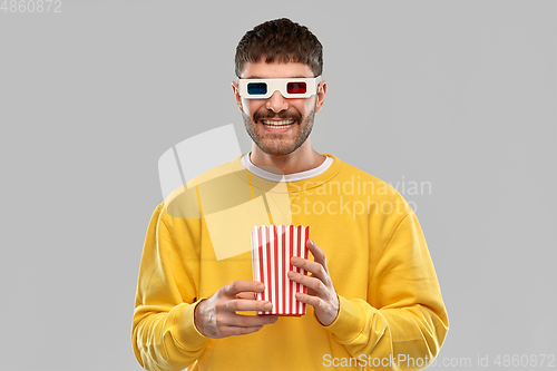 Image of happy man 3d movie glasses with popcorn in bucket