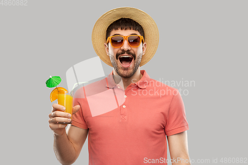 Image of happy man in straw hat with orange juice cocktail