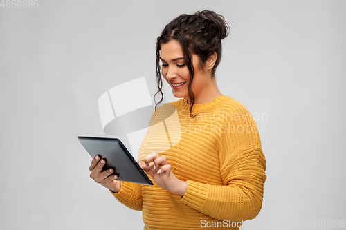 Image of happy young woman using tablet pc computer