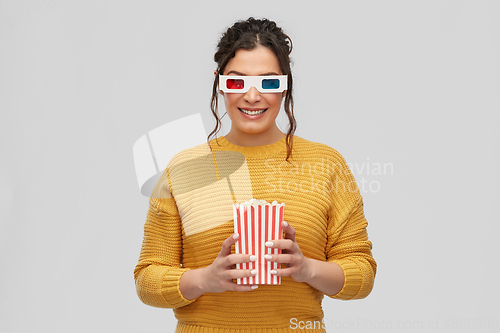 Image of happy woman in 3d movie glasses with popcorn