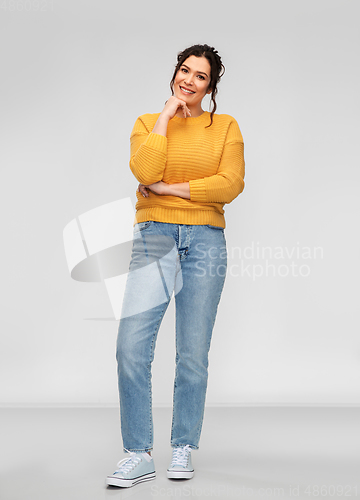 Image of happy smiling young woman with pierced nose