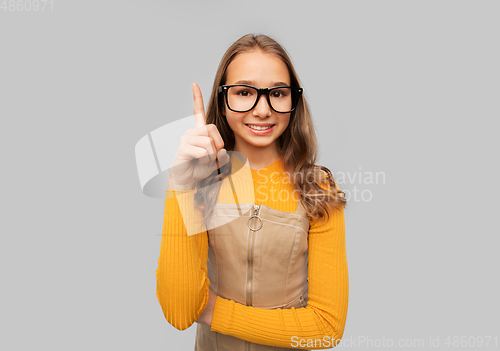 Image of smiling teenage student girl in glasses