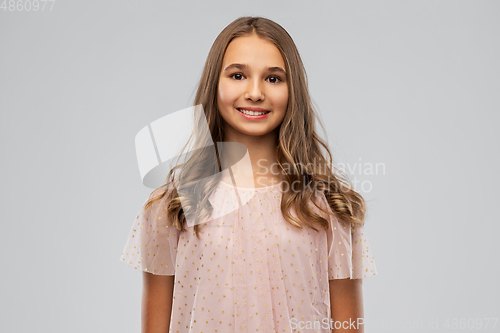 Image of smiling young teenage girl in party dress