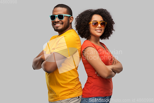 Image of happy african american couple in sunglasses