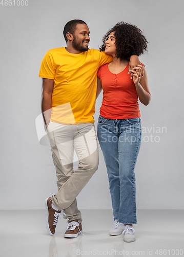 Image of happy african american couple hugging