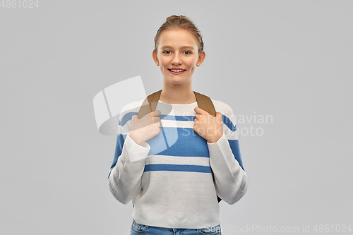 Image of smiling teenage student girl with school bag