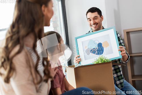 Image of happy family with child moving to new home