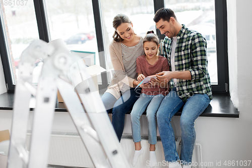 Image of happy family with color palette moving to new home