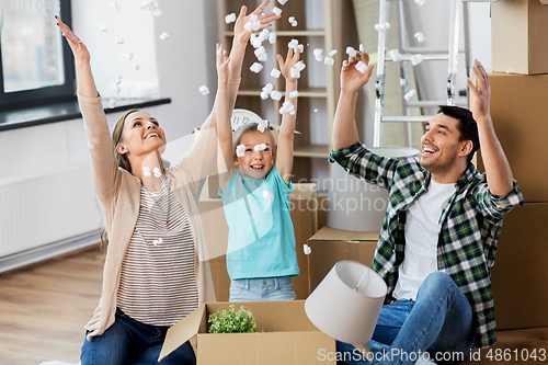 Image of happy family playing with foam peanuts at new home