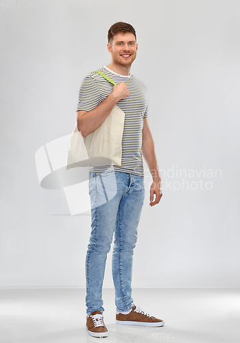 Image of man with reusable canvas bag for food shopping