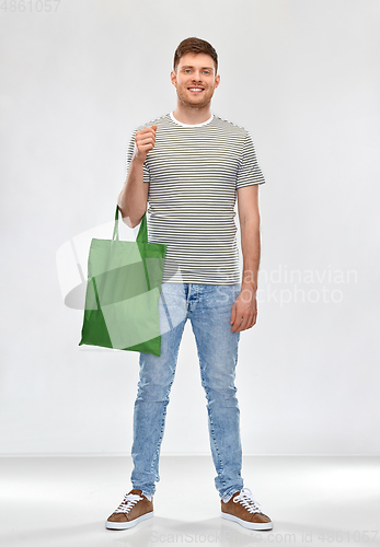 Image of man with reusable canvas bag for food shopping