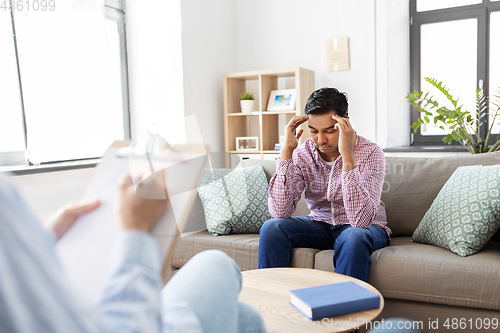 Image of man and psychologist at psychotherapy session