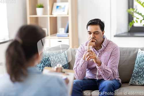 Image of man and psychologist at psychotherapy session