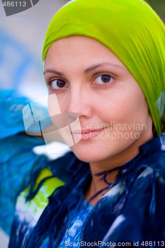 Image of pretty woman in green kerchief