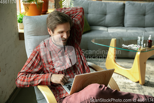 Image of Caucasian man staying at home during quarantine because of coronavirus spreading