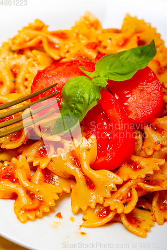 Image of Italian pasta farfalle butterfly bow-tie and tomato sauce