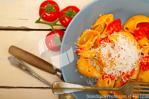 Image of Italian snail lumaconi pasta with tomatoes