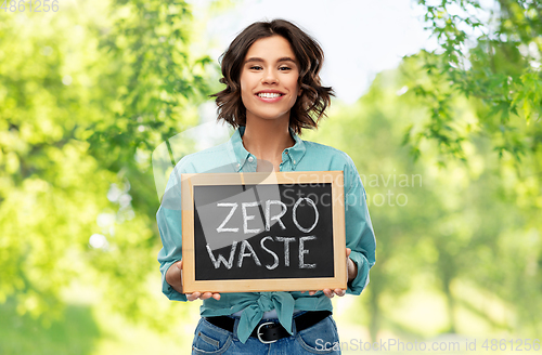 Image of happy woman with chalkboard with zero waste words