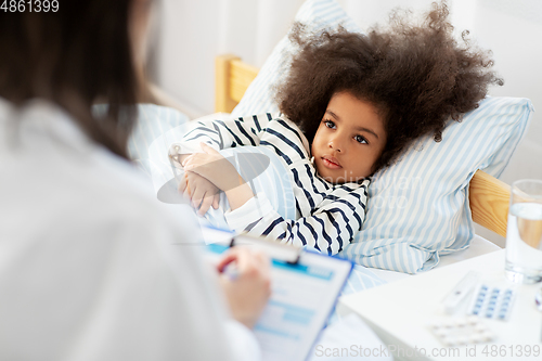 Image of doctor with clipboard and sick girl in bed at home