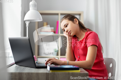 Image of student girl with laptop computer learning at home