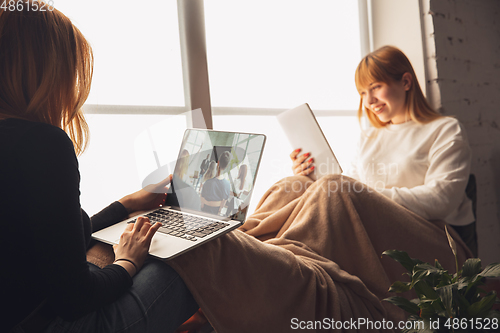 Image of Young friends, women using gadgets to watch cinema, photos, online courses, taking selfie or vlog