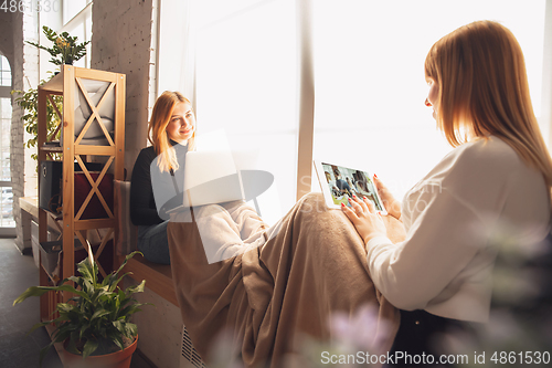 Image of Young friends, women using gadgets to watch cinema, photos, online courses, taking selfie or vlog