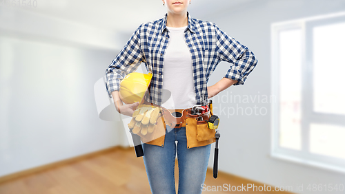 Image of woman or builder with helmet and working tools