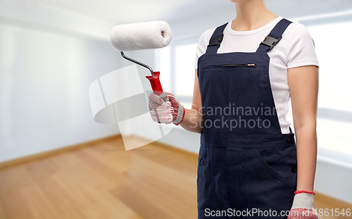 Image of close up of painter or builder with paint roller