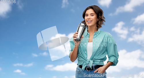 Image of woman with thermo cup or tumbler for hot drinks