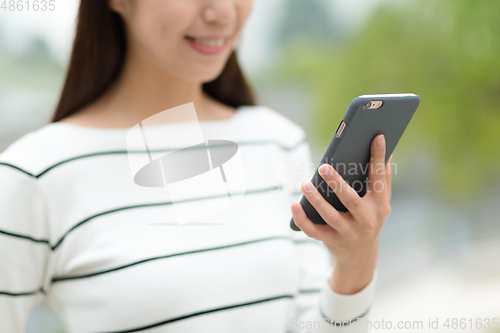 Image of Woman using mobile phone