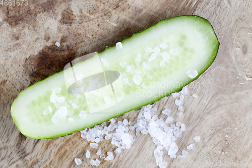 Image of salt on half a cucumber