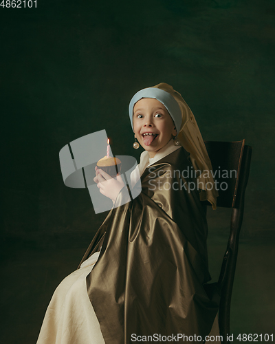 Image of Medieval little girl as a lady with a pearl earring on dark studio background. Concept of comparison of eras, childhood. Stylish creative design, art vision, new look of artwork.