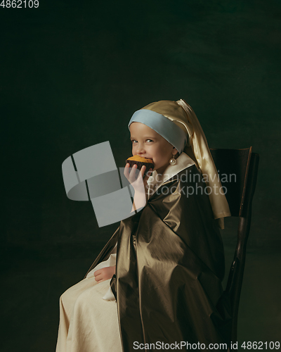 Image of Medieval little girl as a lady with a pearl earring on dark studio background. Concept of comparison of eras, childhood. Stylish creative design, art vision, new look of artwork.